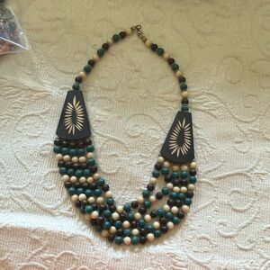 Beaded necklace with carved wood accents